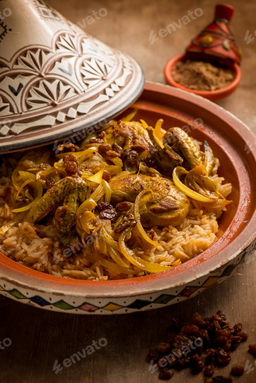 Preview: traditional moroccan chicken tajine with vegetables and dried grapes