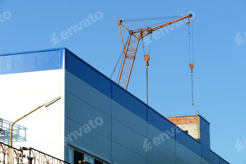 Preview: The crane works on the construction site.