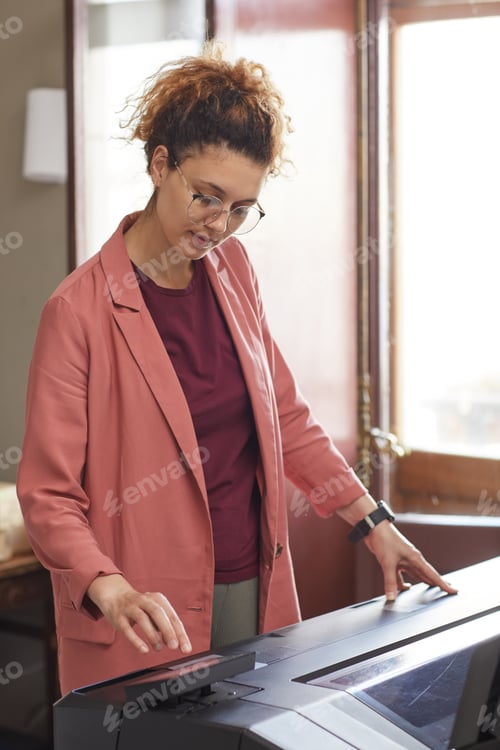 Preview: Woman working on printed machine