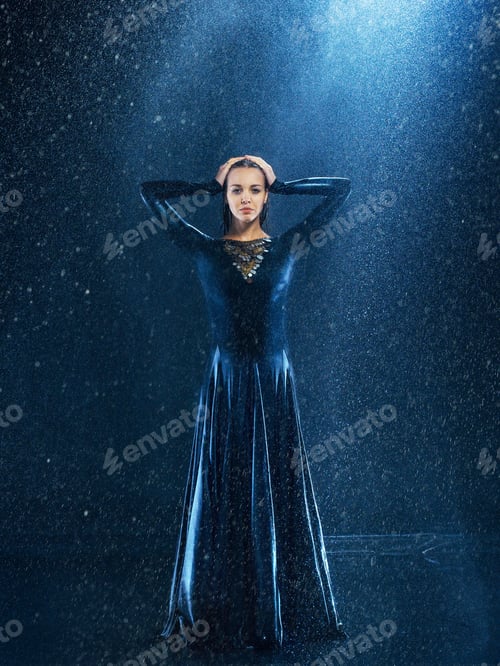 Preview: The young beautiful modern dancer dancing under water drops