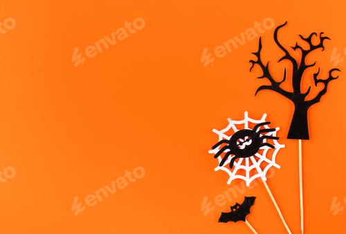 Preview: Childish Halloween flat lay with cute small holiday symbols on bright orange