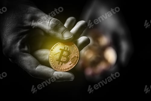 Preview: Golden Bitcoin in a man hand