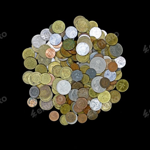 Preview: Mound of German Mark and assorted value coins isolated on black.