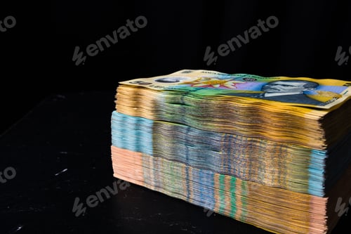 Preview: Closeup of the Romanian LEI bill piles on a black background