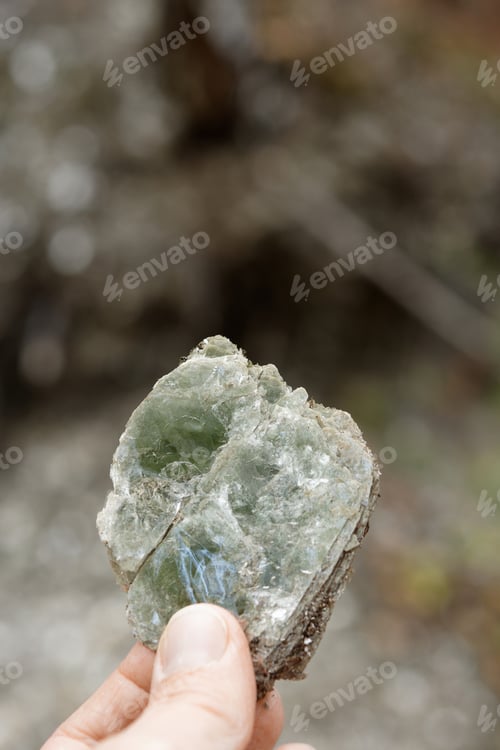 Preview: Macro photography of unprocessed pieces of mica minerals in a natural deposit.