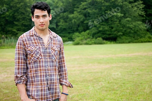 Preview: Portrait of young man in field