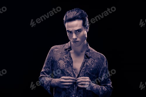 Preview: One Young Adult Handsome Man Model, Looking At Camera, Buttoning Shirt, Blue Duetone