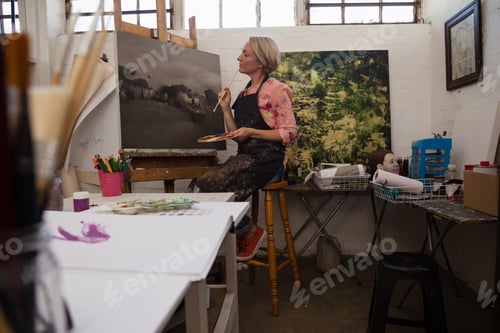 Preview: Woman painting on canvas