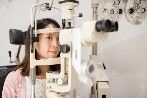 Preview: Young woman is having eye exam