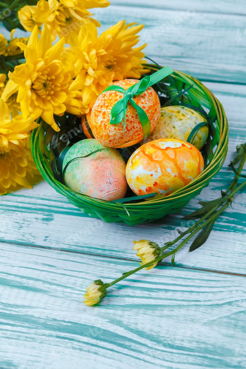 Preview: Easter eggs with tulips on blue wooden background