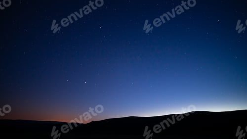 Preview: Silhouettes of hills under a starry sky at night - perfect for wallpapers and backgrounds