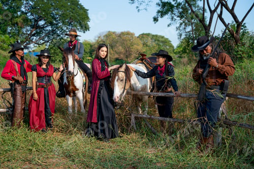 Preview: Group of cowboy and cowgirl stay near fence in grasses field and they also bring horse beside