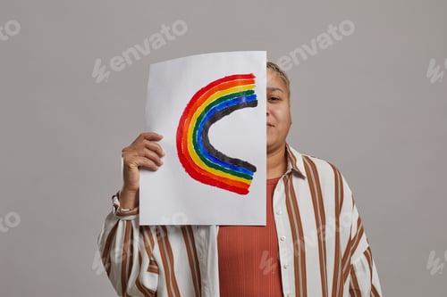 Preview: Mixed Race Woman Holding Rainbow Sign