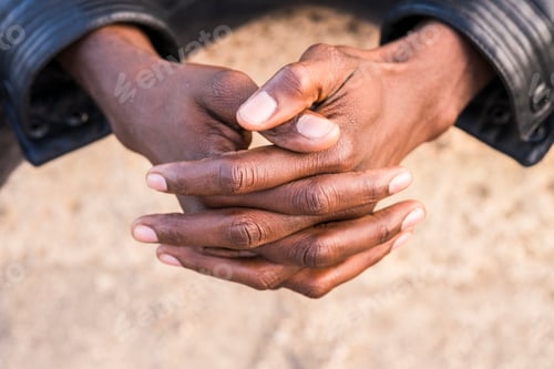 Preview: Young north african man, hands folded