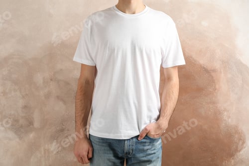 Preview: Men in blank white t-shirt against brown background, space for text