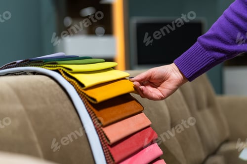 Preview: A women looks at tissue samples. Selects the color of the sofa.