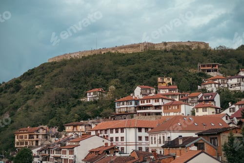 Preview: View of Prishtina, Kosovo, featuring a series of houses and buildings on a hill
