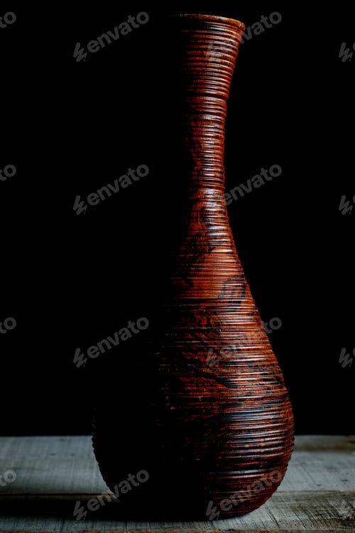 Preview: Old vase on a wooden floor