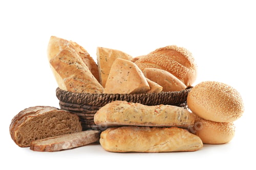 Preview: Different kinds of bread and wicker basket on white background