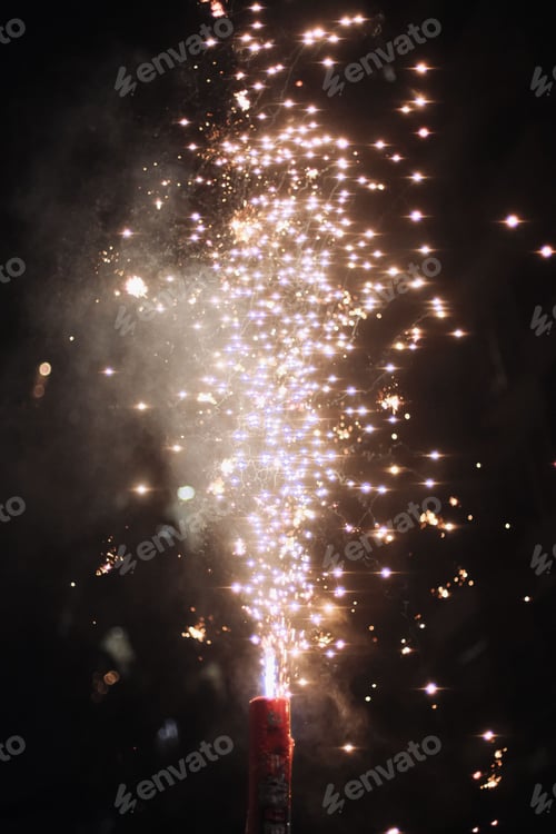 Preview: Bright and colorful display of aerial fireworks against a night sky
