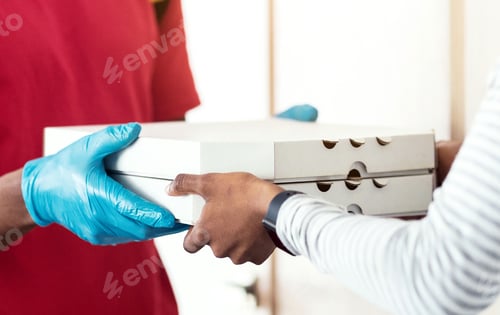 Preview: Courier Delivering Pizza Wearing Face Mask And Gloves Indoors, Cropped