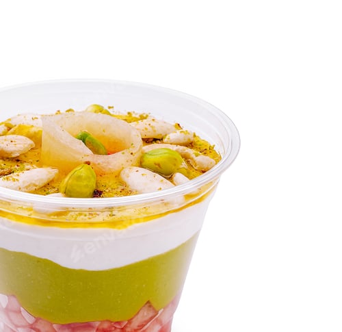 Preview: Delicious layered dessert with fruits, yogurt, and nuts in a clear cup