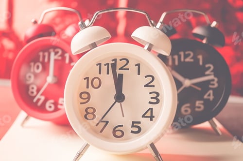 Preview: Alarm Clock And Bokeh On Red Background