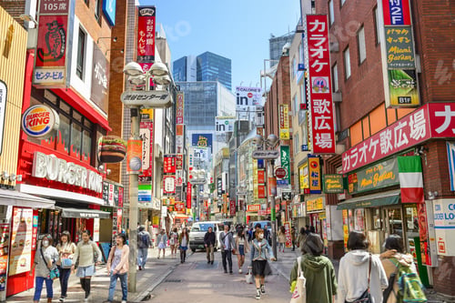 Preview: Tokyo, Japan - March 31, 2014: Pedestrians Stroll Down Shibuya Cener-Gai. The Area Is A Popular