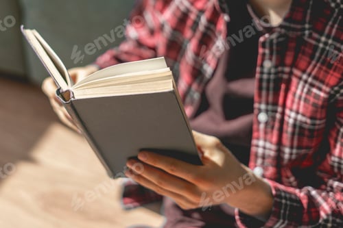 Preview: the close up person hands holding the book and reading, get some knowledge