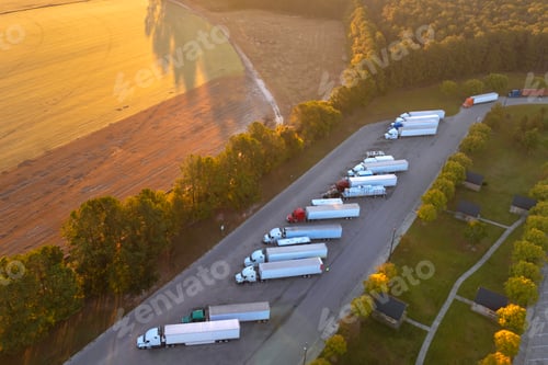 Preview: Truck stop at state welcome center near busy American interstate freeway.