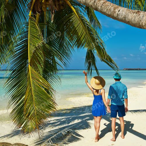 Preview: Couple In Blue Clothes On A Tropical Beach At Maldives