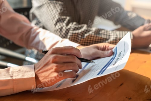 Preview: Young man completes a job application document at the company.
