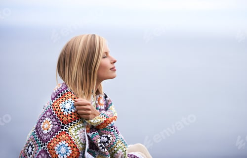 Preview: Morning contemplation. Shot of a beautiful young woman standing at the ocean.