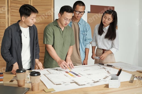 Preview: Large group of architects discussing sketch of construction