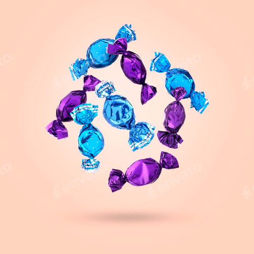 Preview: Candies in bright wrappers falling on pink background