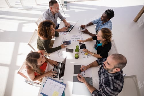 Preview: Executives interacting with each other during meeting