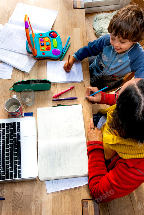 Preview: Toddler boy learning from mother working from home