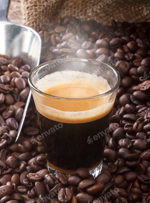 Preview: Espresso coffee in glass cup with coffee beans.
