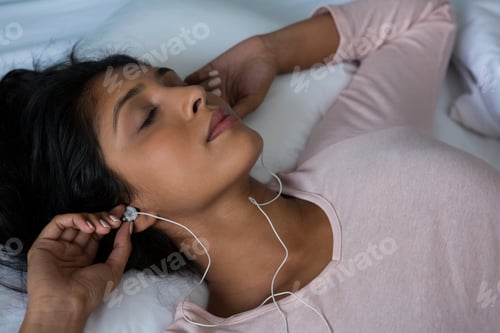 Preview: Woman sleeping while listening to music