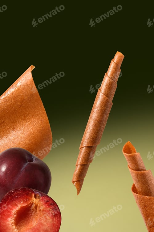 Preview: Lozenges in the air on a green background. Natural, healthy breakfast. Vitamins. Plum dessert.