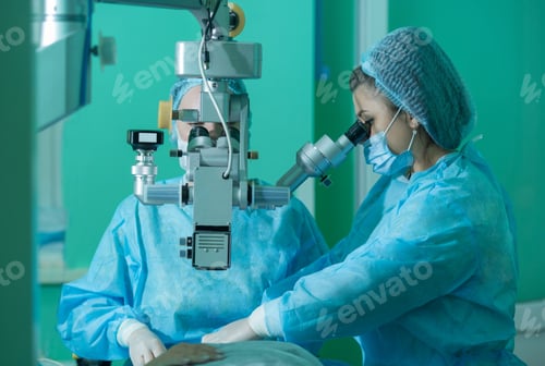 Preview: a young woman ophthalmologist performs an operation on the patient's eye