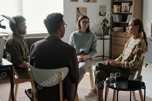 Preview: Diverse Group of Young Adults Participating in Therapy Session Indoors