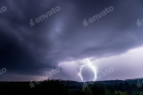 Preview: Beautiful thunderstorm with clouds and lightning over the night city