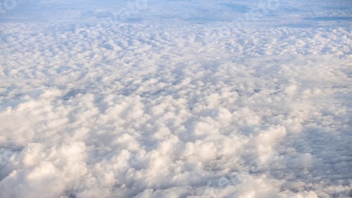 Preview: The beautiful cloudscape with clear blue sky. A view from airplane window.