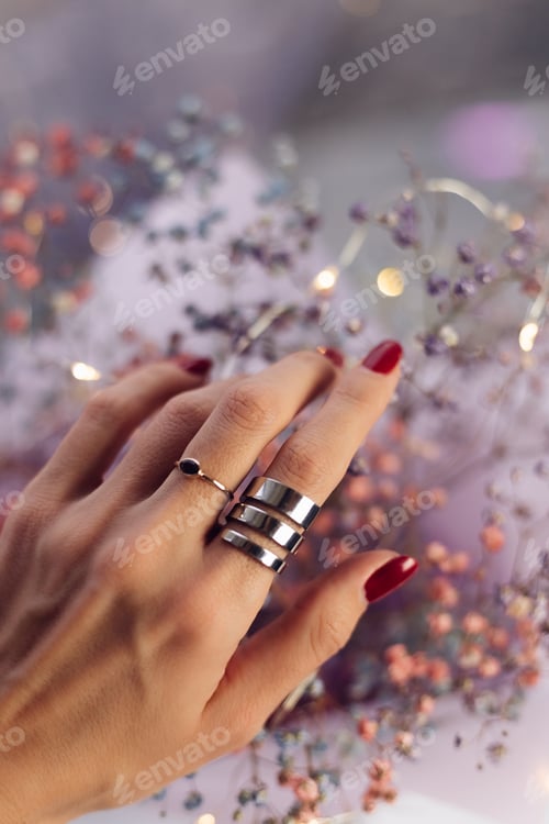 Preview: Close shot of woman hand fingers wearing two rings