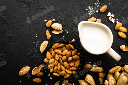 Preview: Homemade almond milk in jug. Almond milk and almonds