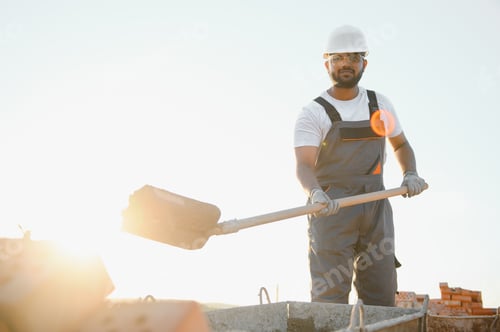 Preview: Indian Construction worker in uniform and safety equipment have job on building