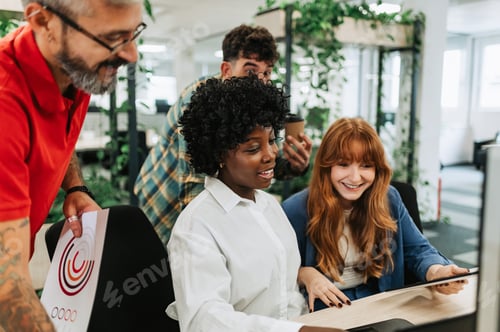 Preview: An interracial businesswoman is collaborating on project with team.