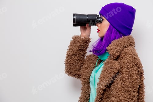 Preview: girl in jacket looking in to binocular