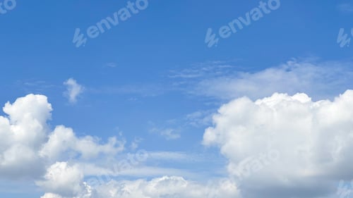 Preview: Fluffy Clouds Floating in the Bright Blue Sky